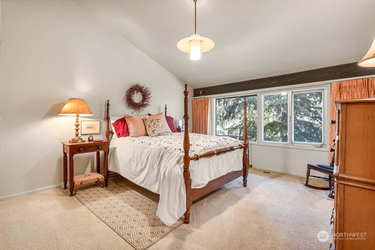 234 Middlefield Road Bellingham, WA 98225 - Photo 26 of 36 a bedroom with a bed and a table