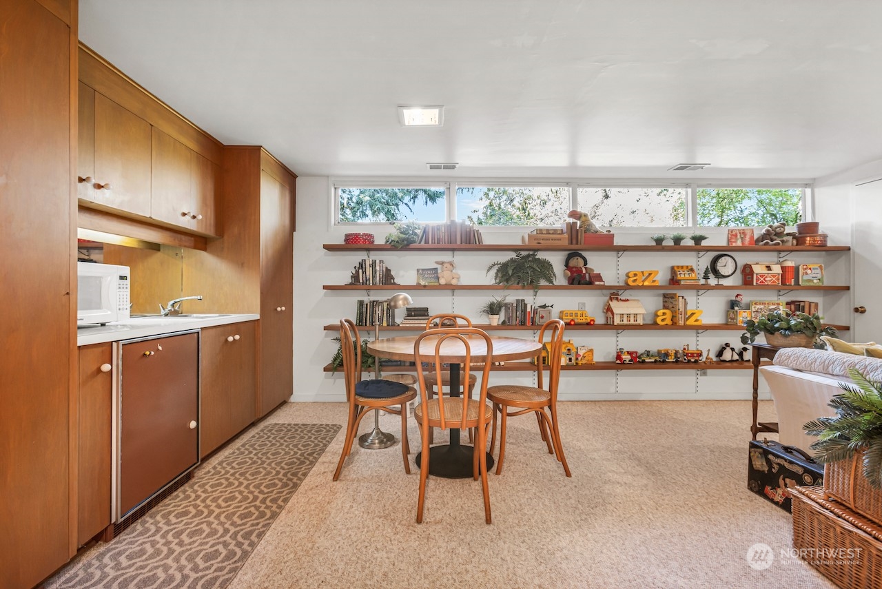 234 Middlefield Road Bellingham, WA 98225 - Photo 30 of 36 a dining room with furniture and a floor to ceiling window