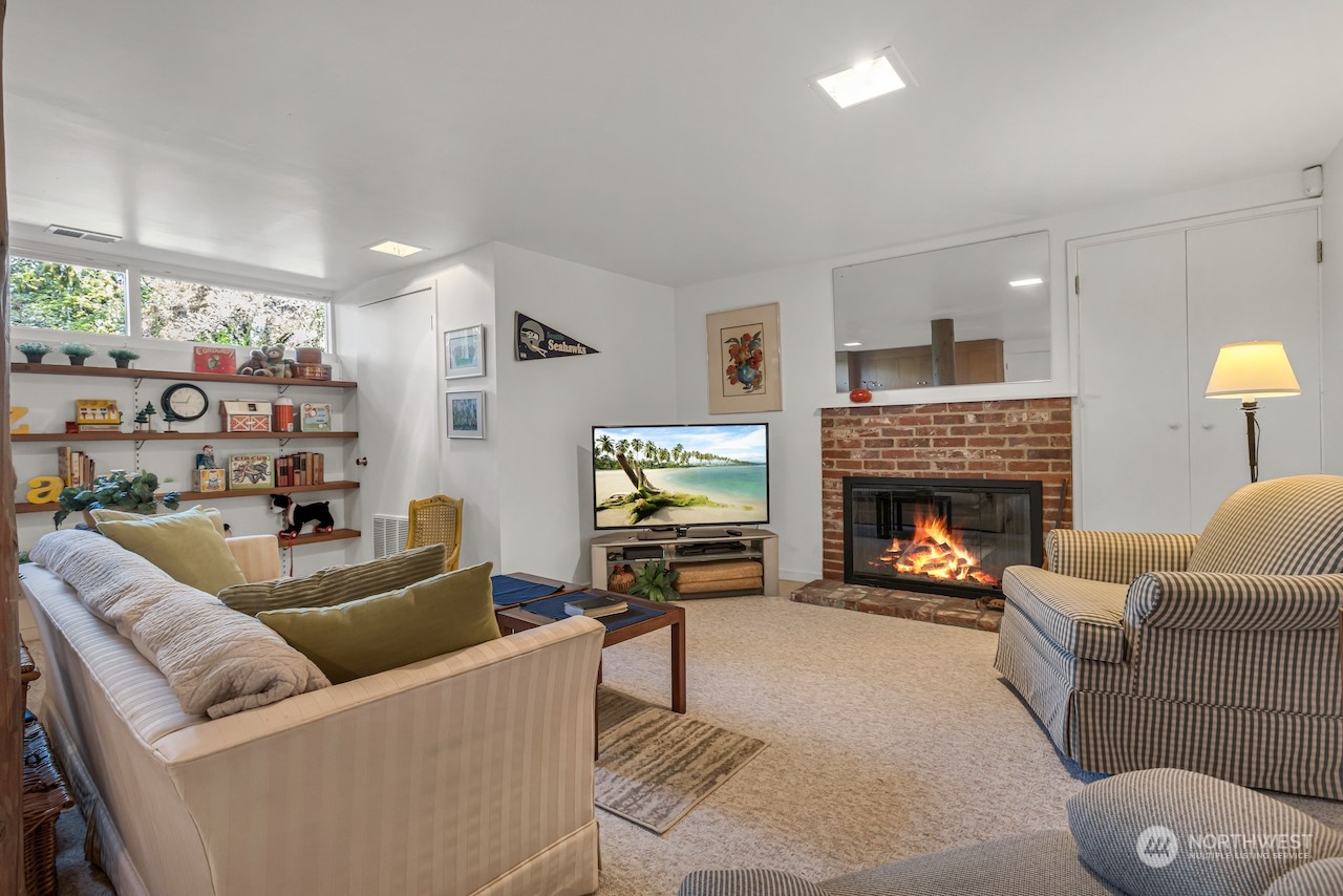 234 Middlefield Road Bellingham, WA 98225 - Photo 31 of 36 a living room with furniture and a fireplace