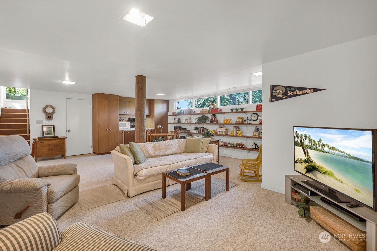 234 Middlefield Road Bellingham, WA 98225 - Photo 32 of 36 a living room with furniture and a flat screen tv
