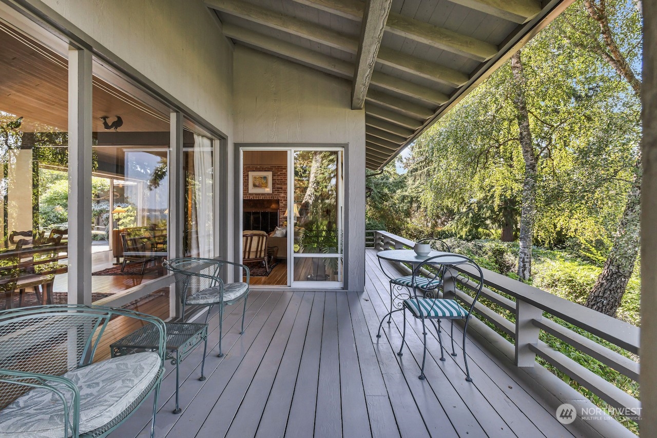 234 Middlefield Road Bellingham, WA 98225 - Photo 4 of 36 a balcony with chairs and wooden floor