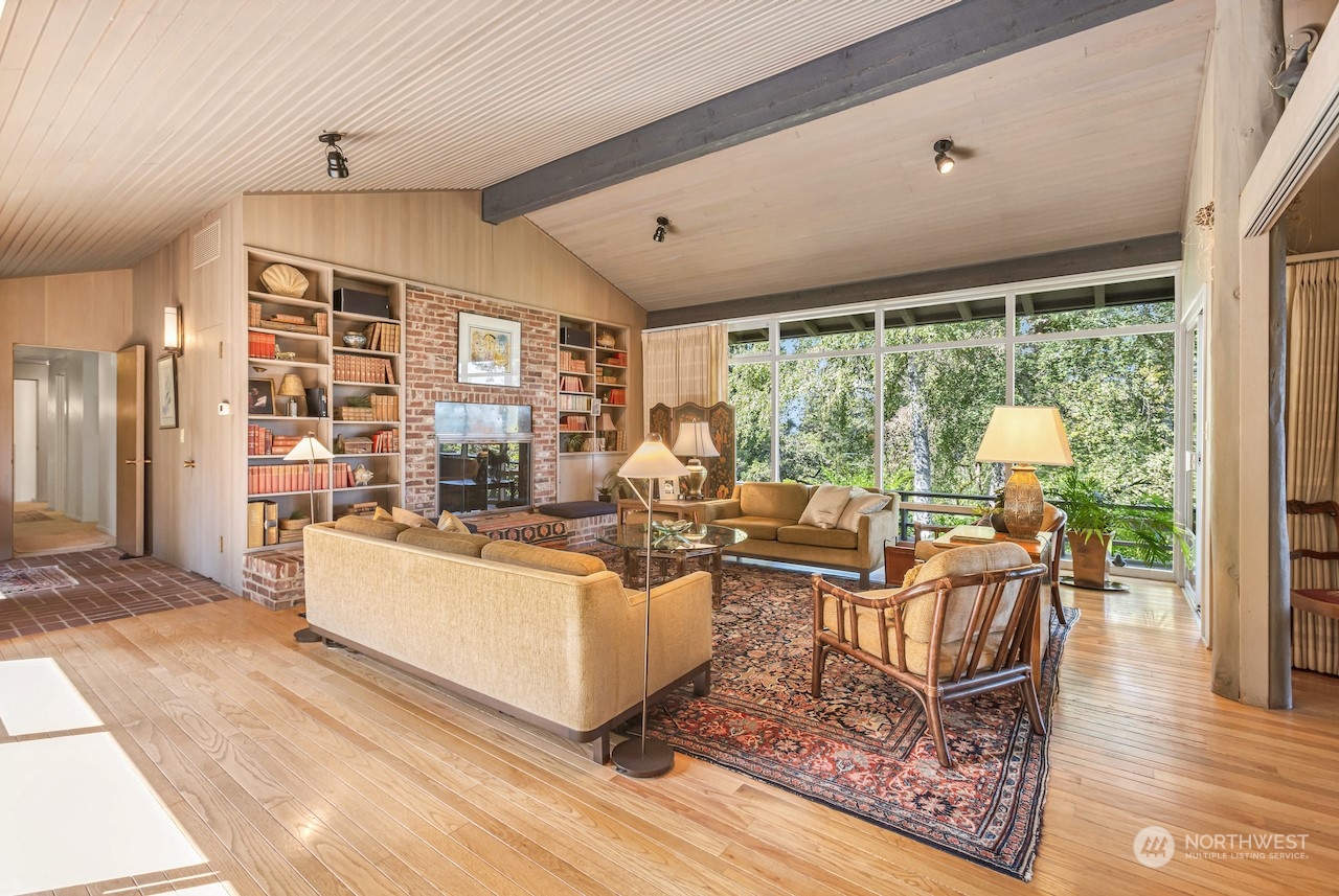 234 Middlefield Road Bellingham, WA 98225 - Photo 7 of 36 a living room with fireplace furniture and a large window