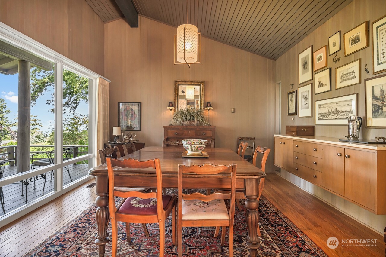 234 Middlefield Road Bellingham, WA 98225 - Photo 10 of 36 a dining room with furniture a chandelier and wooden floor