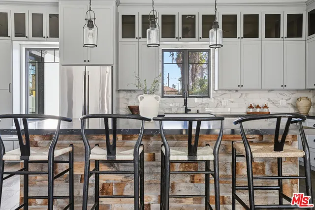 a view of a dining room with furniture and window