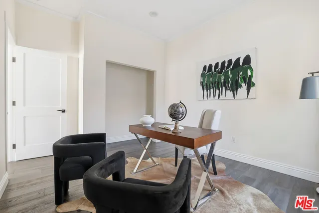a view of a living room hardwood floor and a flat screen tv