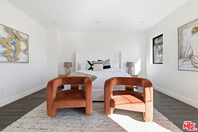 a white bath tub sitting in a bathroom next to a window