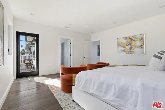 a white toilet sitting next to a shower