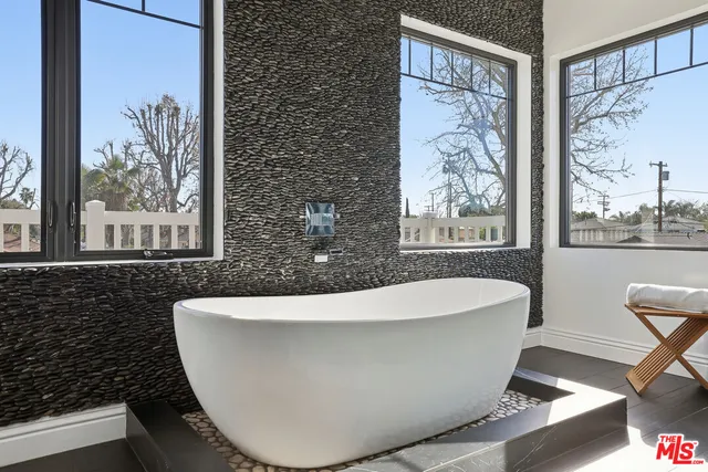 a view of balcony with wooden floor