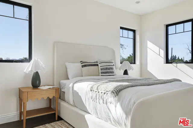 a view of a house with pool and chairs