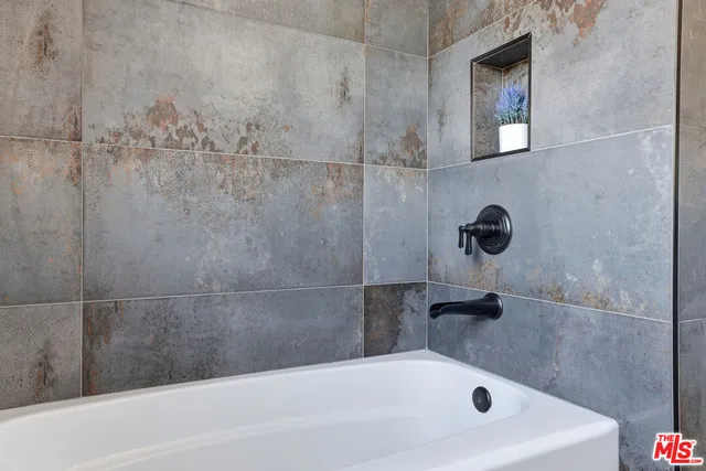 an aerial view of multiple houses with yard