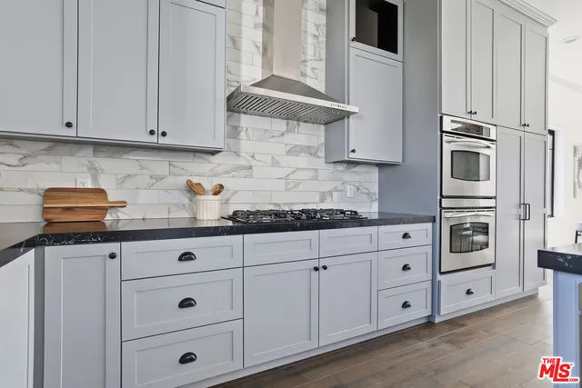 a view of a dining room with furniture and kitchen view
