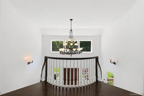 a living room with furniture fireplace and flat screen tv