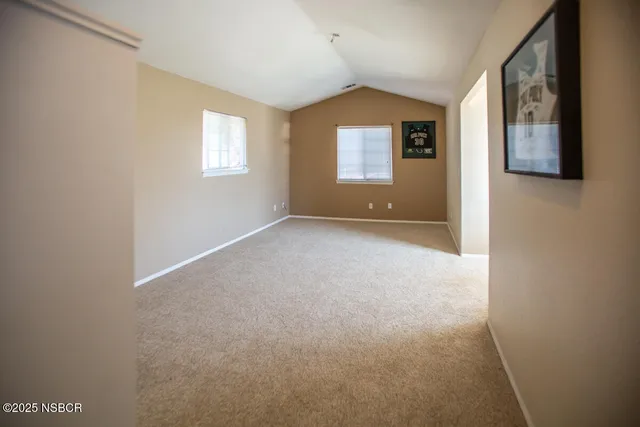 a view of empty room with windows
