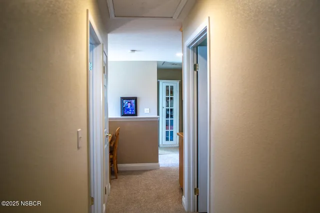 a view of a hallway with shelves