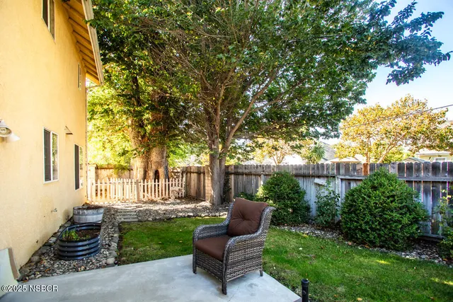a view of a couches in backyard of house