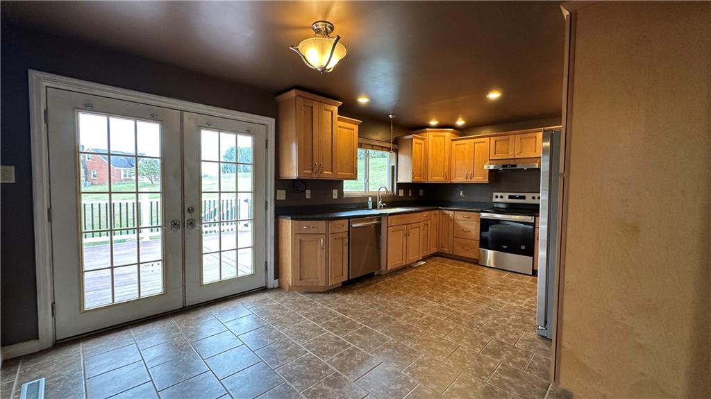 225 Larson Boulevard Rostraver Township, PA 15012 - Photo 11 of 46 a kitchen with a sink cabinets and window