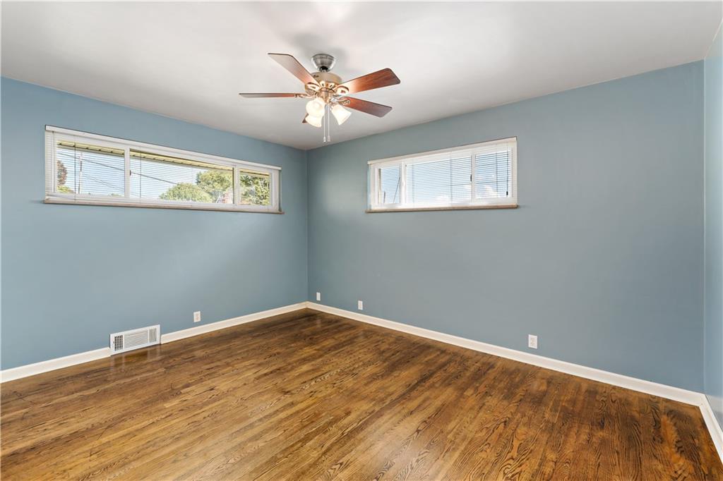 225 Larson Boulevard Rostraver Township, PA 15012 - Photo 17 of 46 a view of empty room with wooden floor