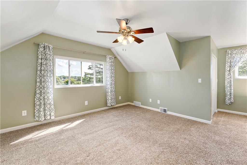 225 Larson Boulevard Rostraver Township, PA 15012 - Photo 24 of 46 an empty room with windows and fan