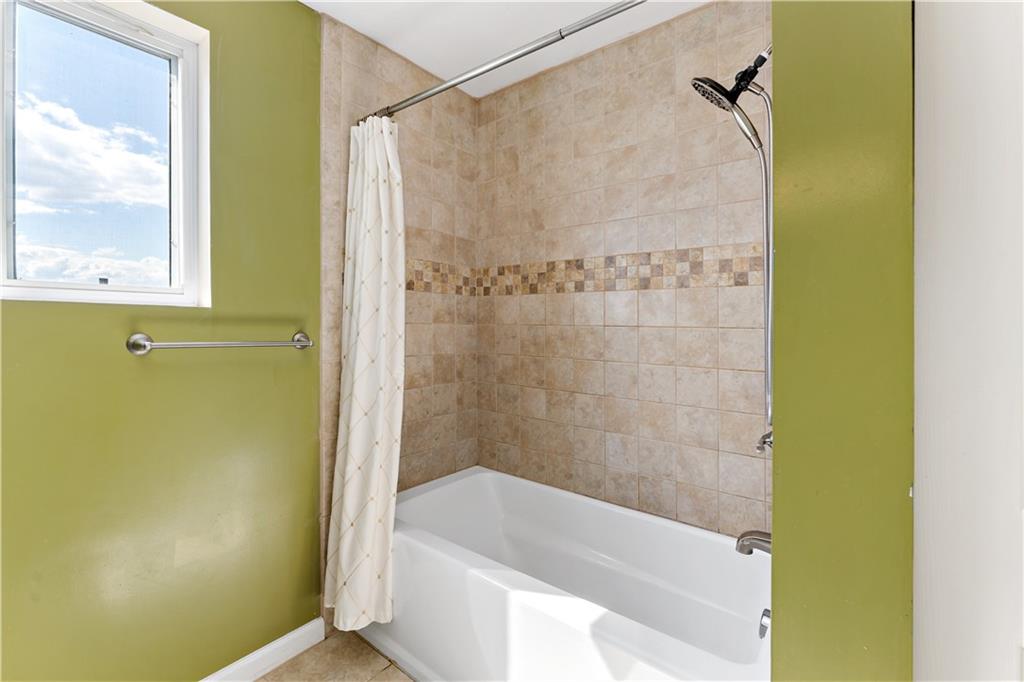 225 Larson Boulevard Rostraver Township, PA 15012 - Photo 28 of 46 a bathroom with a bathtub and a shower