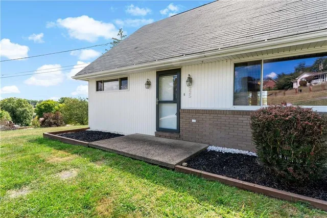 a backyard of a house with lots of green space