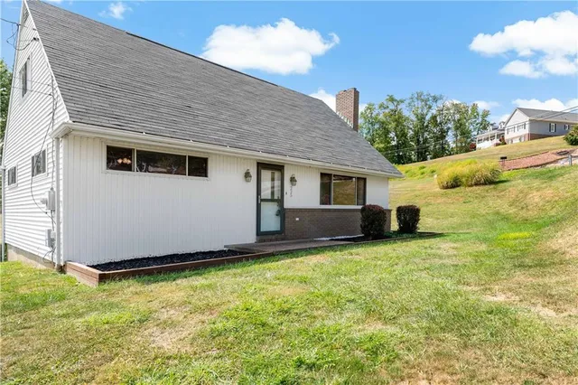 a house with trees in front of it