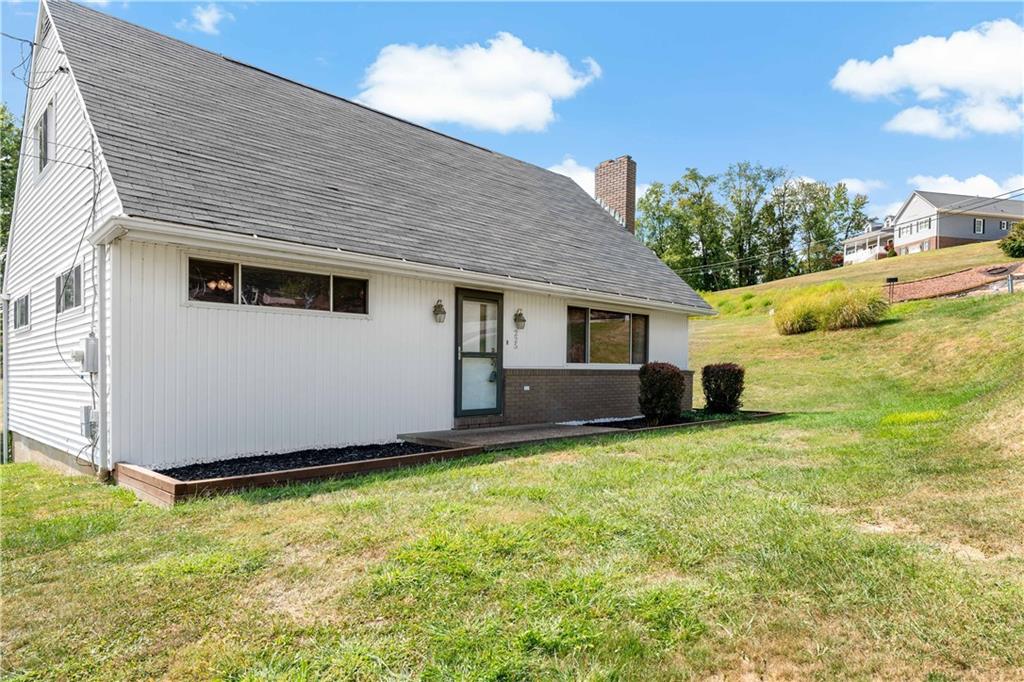 225 Larson Boulevard Rostraver Township, PA 15012 - Photo 36 of 46 a house with trees in front of it