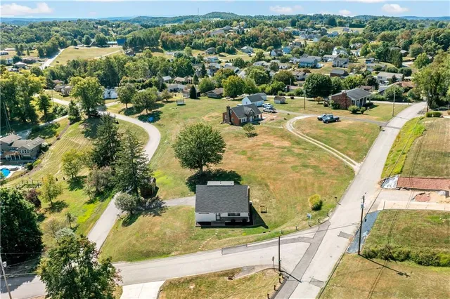 a view of a swimming pool with a yard