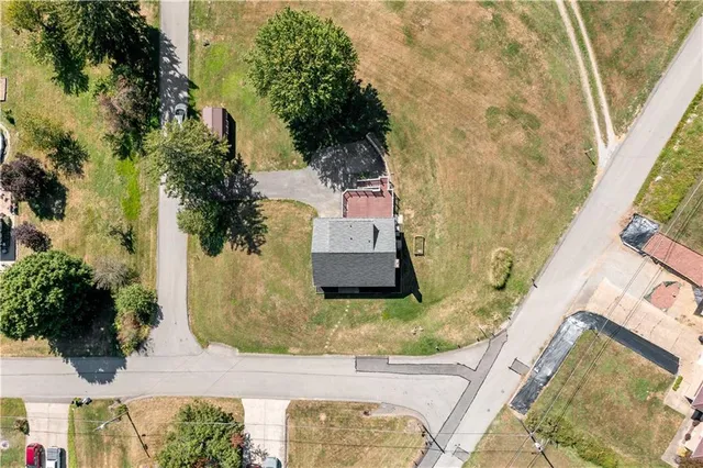 an aerial view of a house with swimming pool
