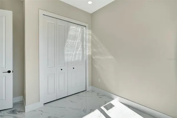 a bathroom with a shower and a sink