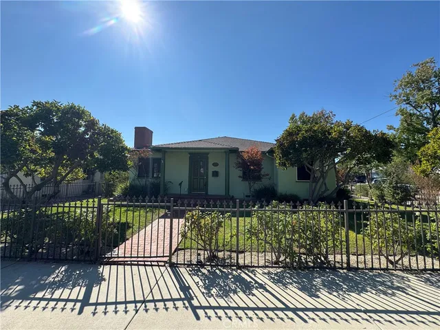 a view of a house with a small yard