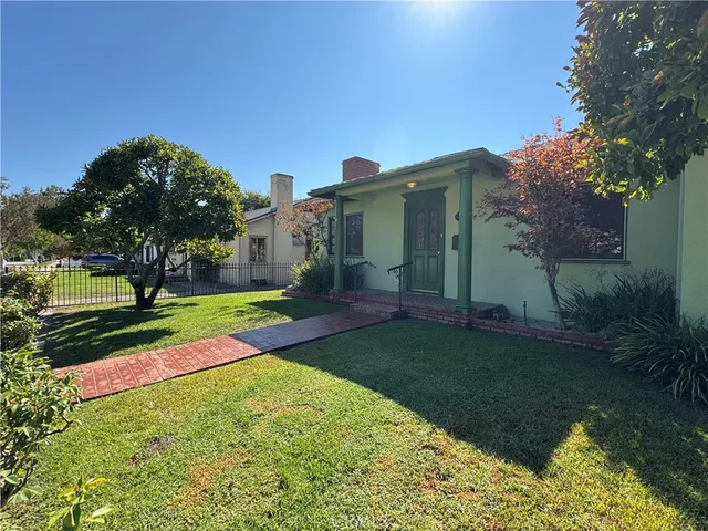 a view of a park with large trees