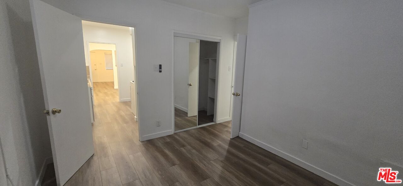 4828 3rd Avenue Los Angeles, CA 90043 - Photo 12 of 15 a view of a hallway with wooden floor