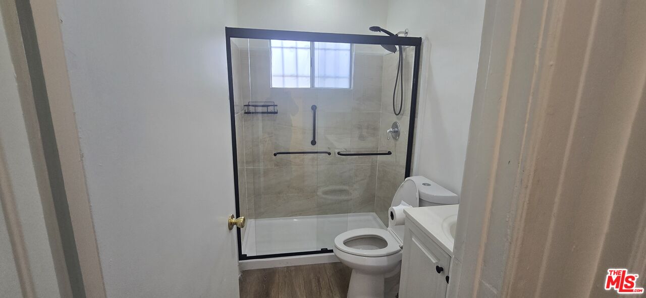 4828 3rd Avenue Los Angeles, CA 90043 - Photo 14 of 15 a bathroom with a shower and toilet