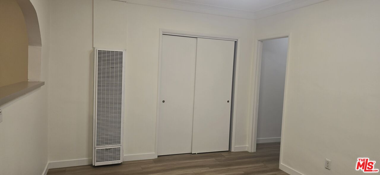 4828 3rd Avenue Los Angeles, CA 90043 - Photo 15 of 15 a view of an empty room with wooden floor