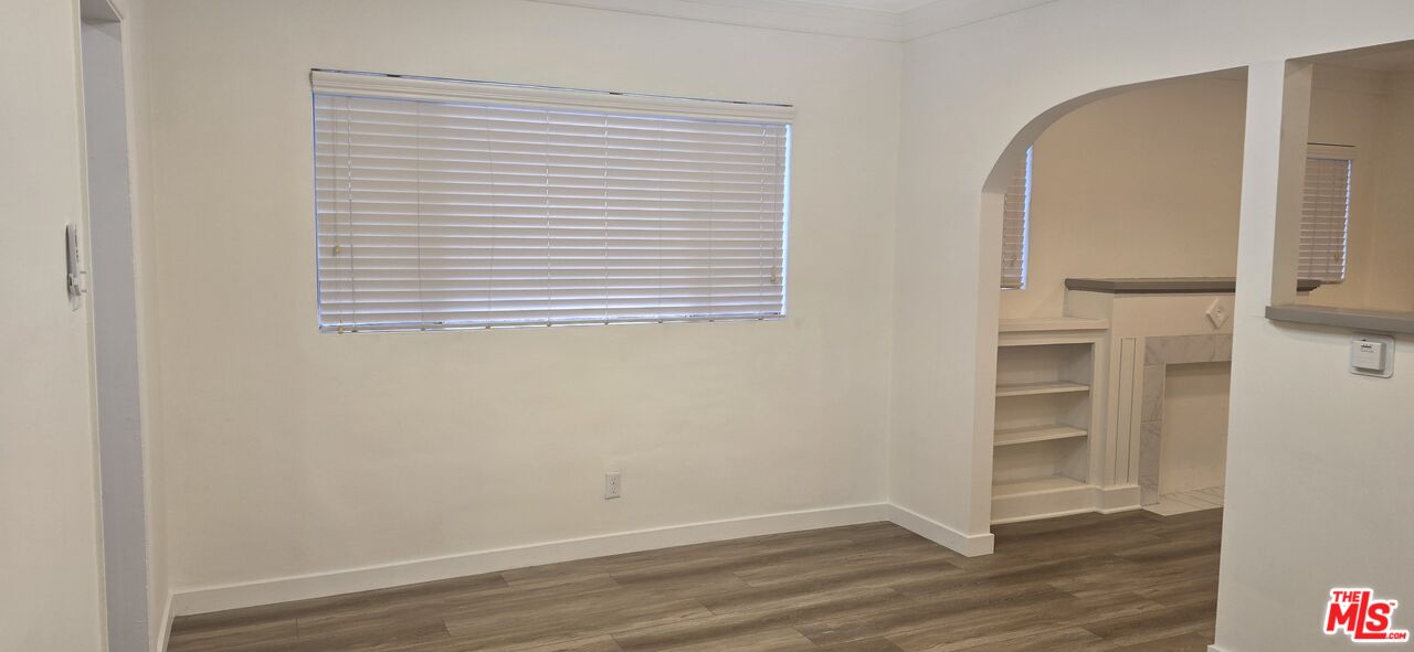 4828 3rd Avenue Los Angeles, CA 90043 - Photo 7 of 15 an empty room with wooden floor and closet