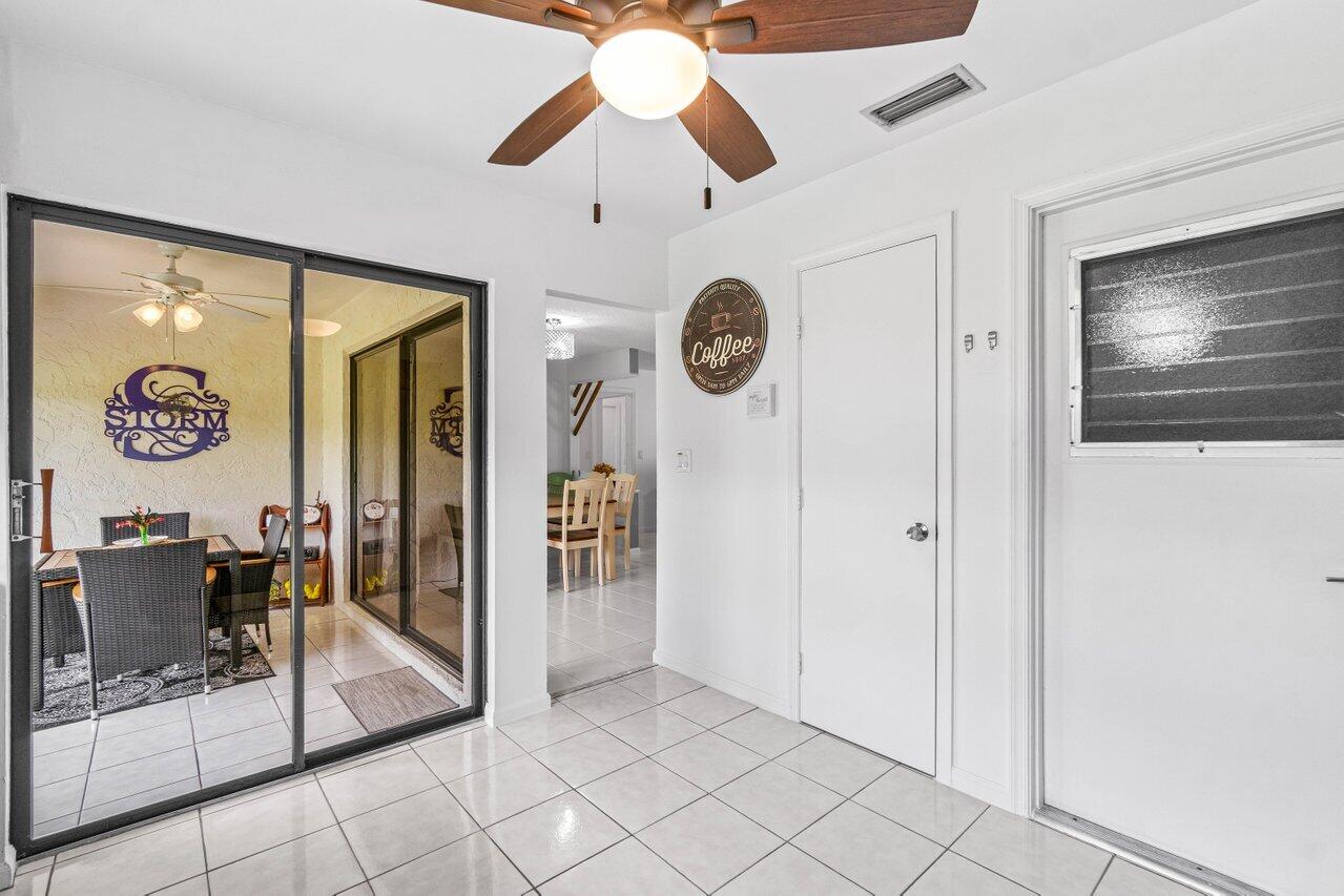 4260 Mango Tree Court, Unit B Boynton Beach, FL 33436 - Photo 11 of 35 Kitchen to Florida Room