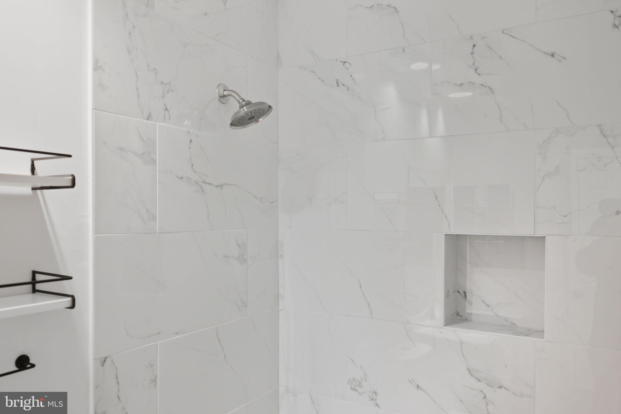 1340 Garden Wall Circle, Unit 502 Reston, VA 20194 - Photo 22 of 32 a bathroom with a shower