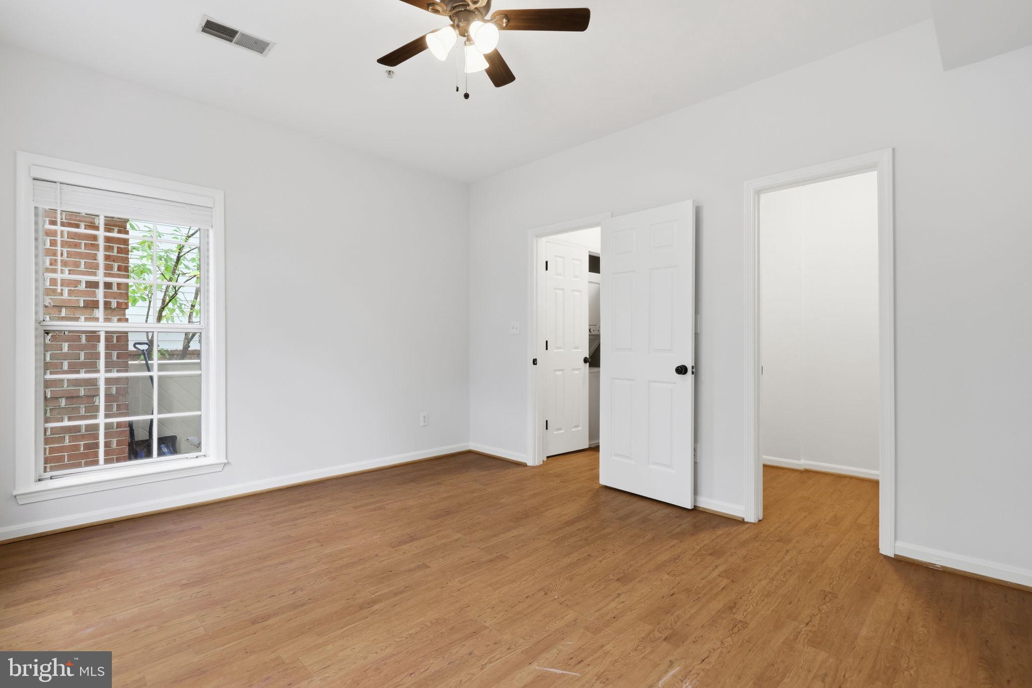 1340 Garden Wall Circle, Unit 502 Reston, VA 20194 - Photo 26 of 32 wooden floor in an empty room with a window