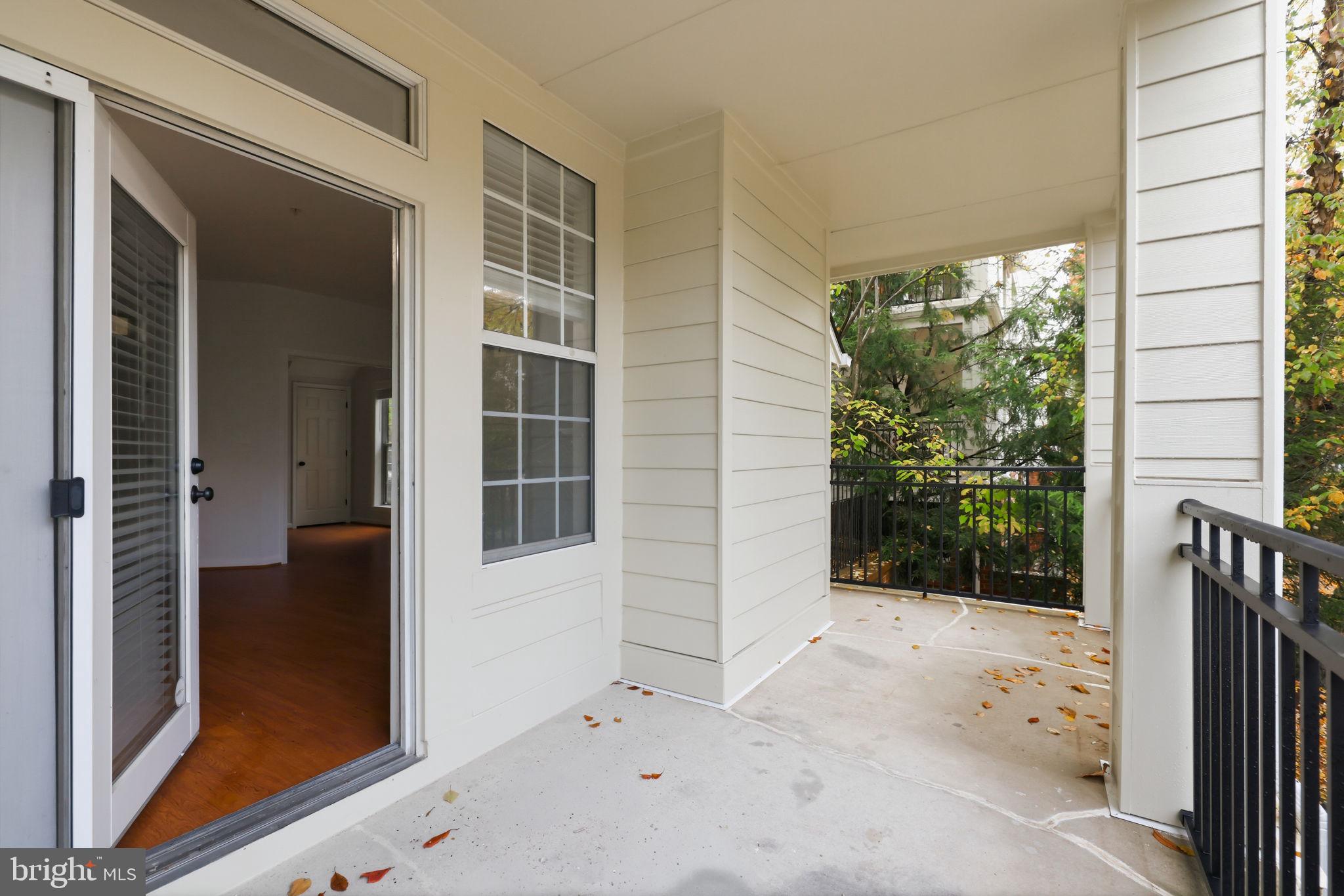 1340 Garden Wall Circle, Unit 502 Reston, VA 20194 - Photo 30 of 32 front view of a house with a glass door