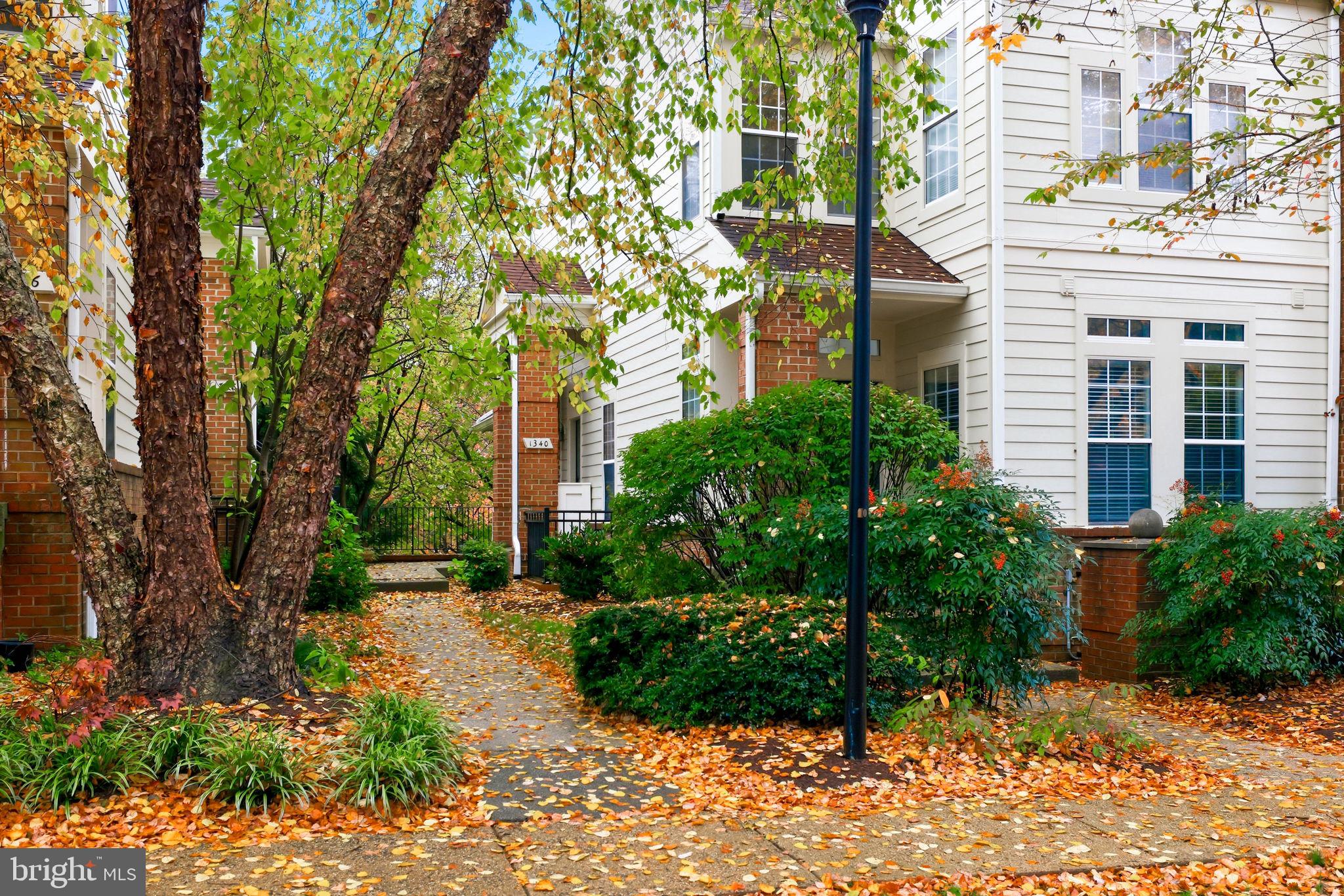 1340 Garden Wall Circle, Unit 502 Reston, VA 20194 - Photo 4 of 32 a view of a pathway both side of house
