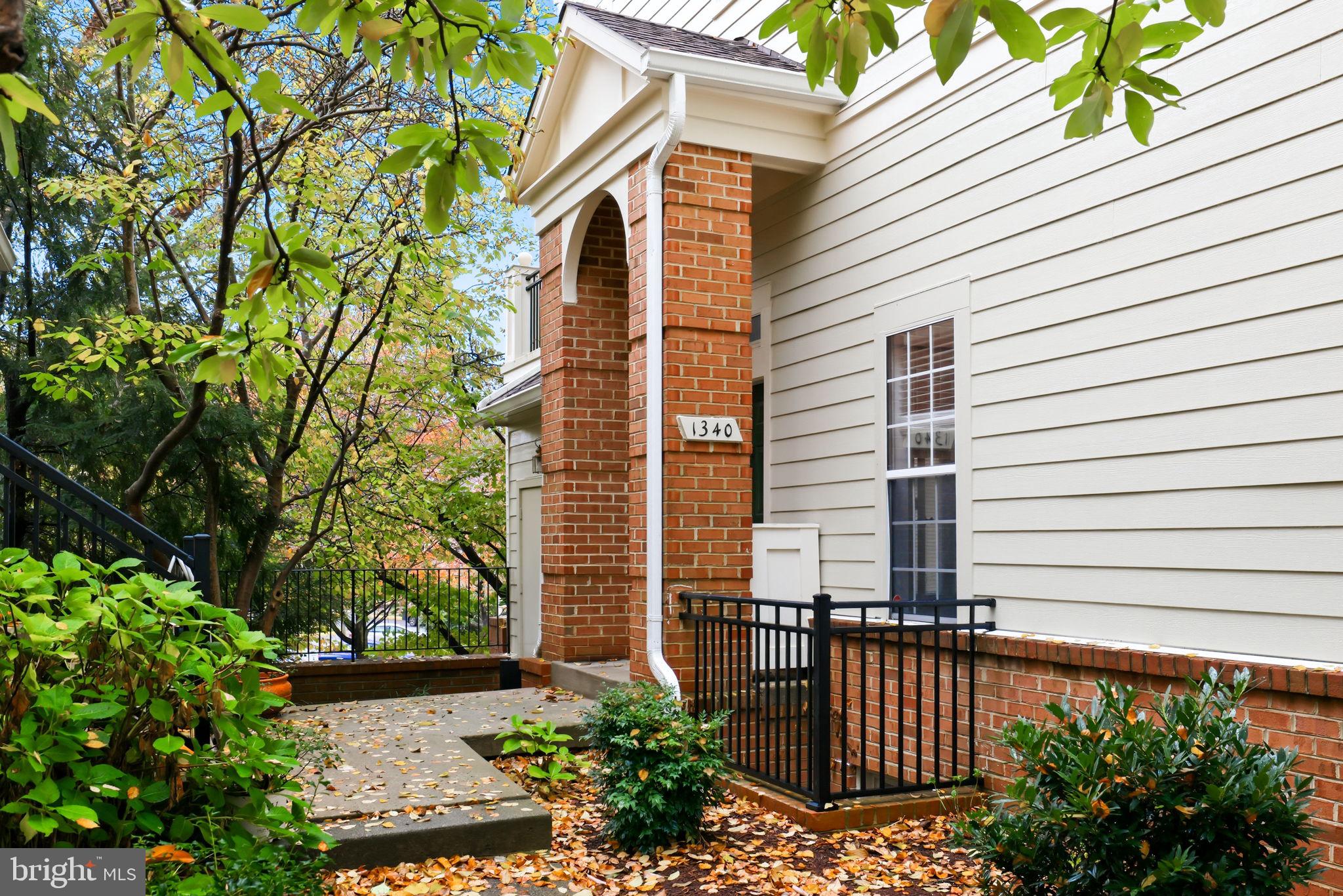 1340 Garden Wall Circle, Unit 502 Reston, VA 20194 - Photo 5 of 32 a view of a house with a yard