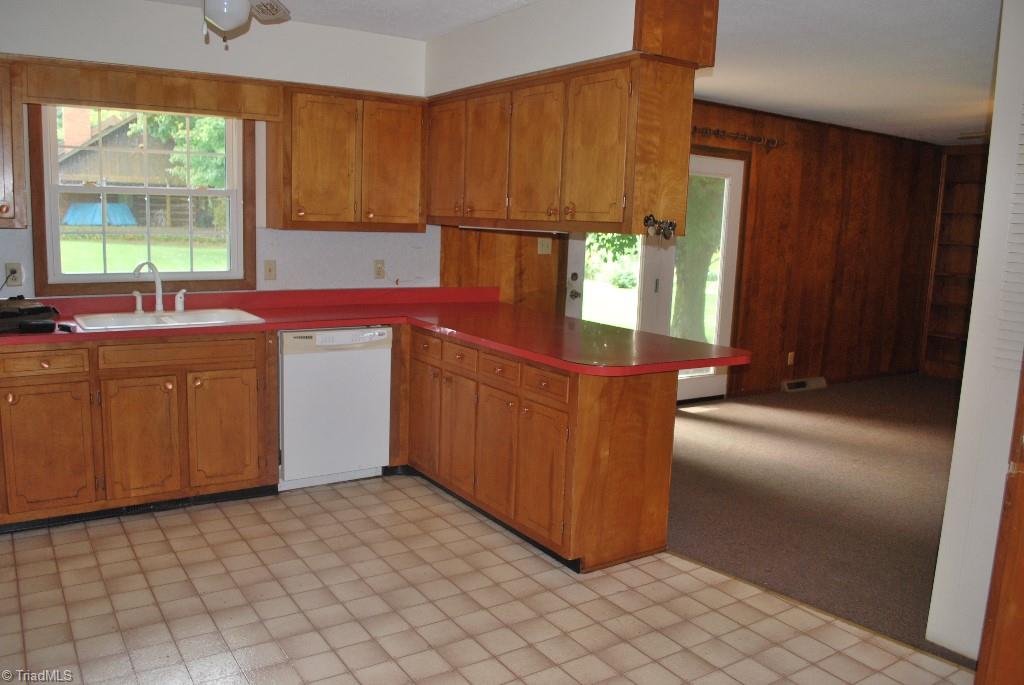 412 Summit Road High Point, NC 27265 - Photo 3 of 10 View of kitchen through to den with fireplace.