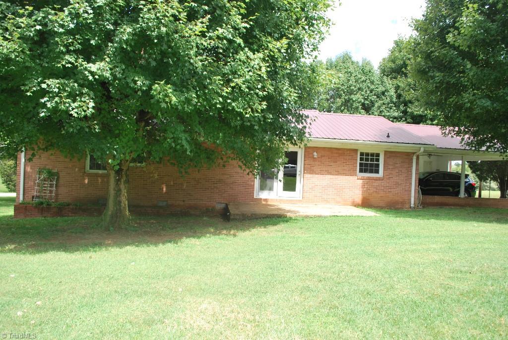412 Summit Road High Point, NC 27265 - Photo 10 of 10 Back of the house showing patio. There is also a storage building on the property.