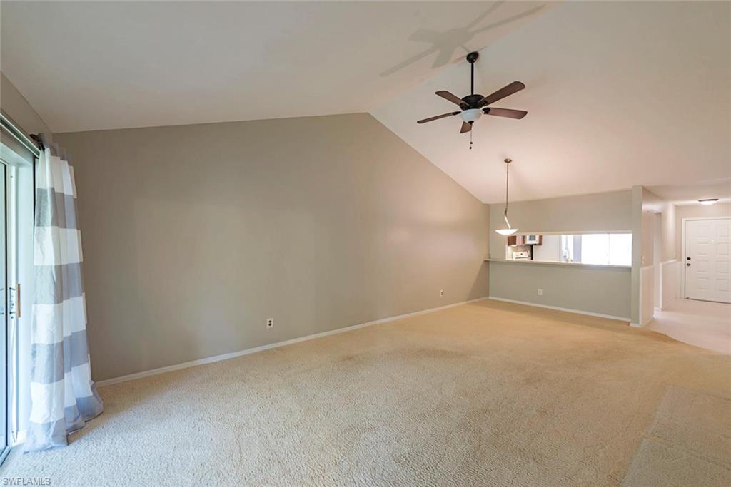 3451 County Barn Road, Unit G204 Naples, FL 34112 - Photo 3 of 12 an empty room with a empty space and a ceiling fan