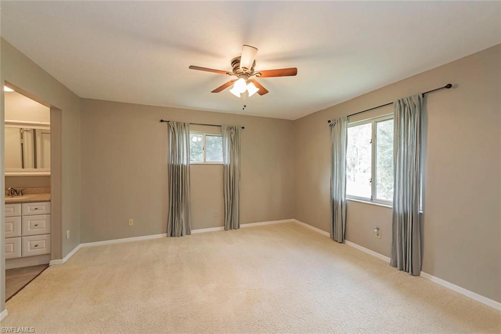 3451 County Barn Road, Unit G204 Naples, FL 34112 - Photo 6 of 12 a view of an empty room with a window
