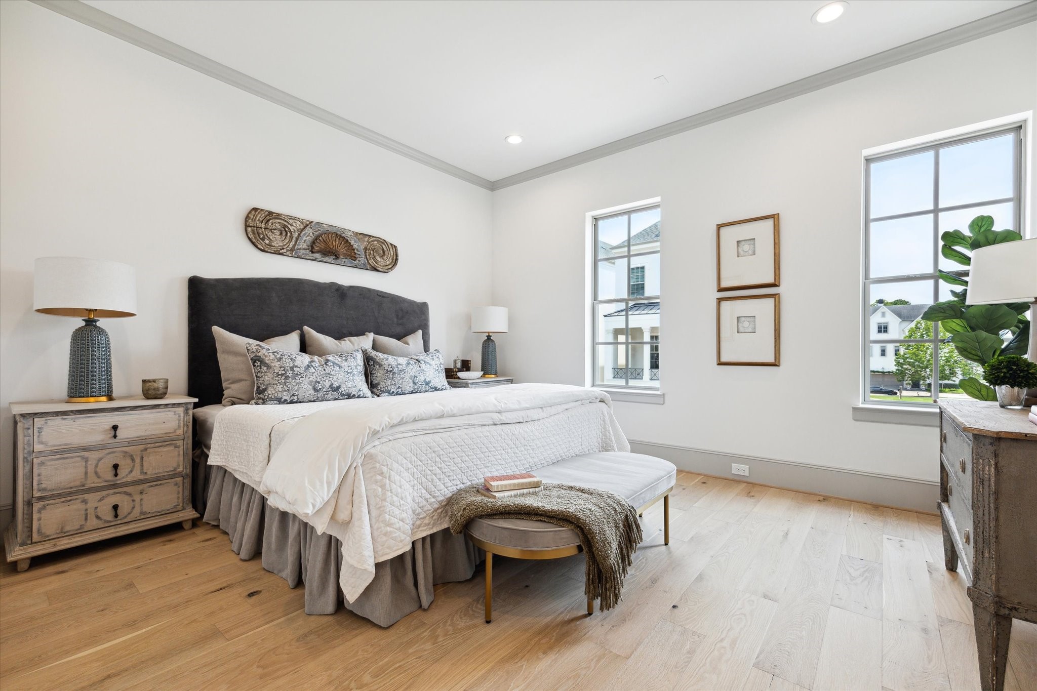 207 Sutton Row Place Houston, TX 77024 - Photo 13 of 29 Light-filled Primary Suite with His and Hers walk-in closets and luxurious bath.