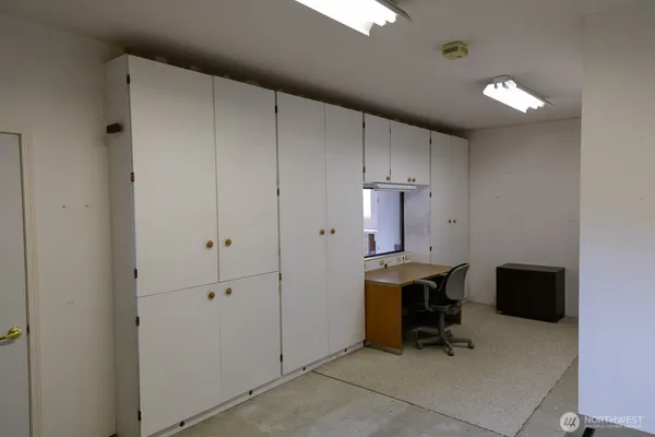 a large living room with furniture a flat screen tv