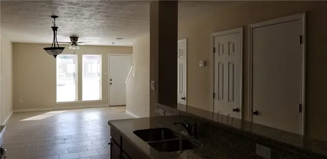 a view of a bathroom with a sink and a window