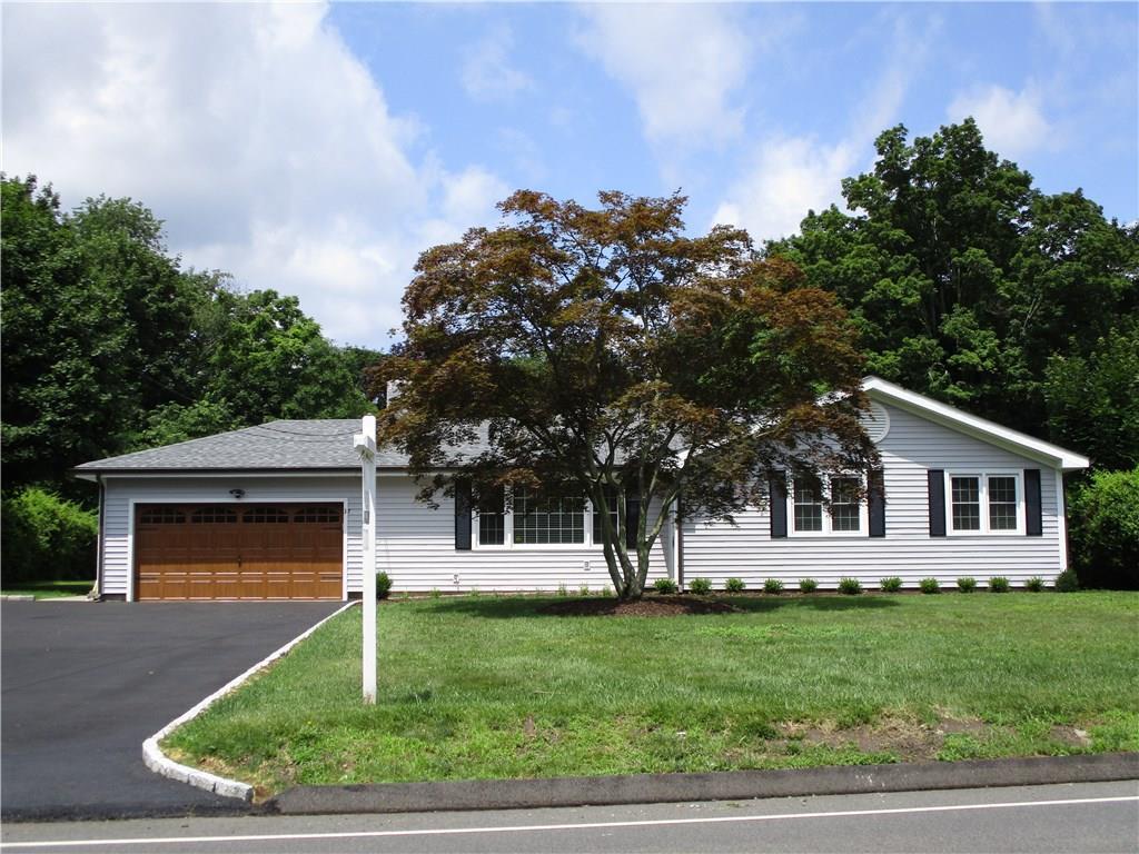 37 Chestnut Hill Road Norwalk, CT 06851 - Photo 1 of 1 a front view of a house with a yard