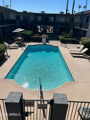 a view of a backyard with sitting area
